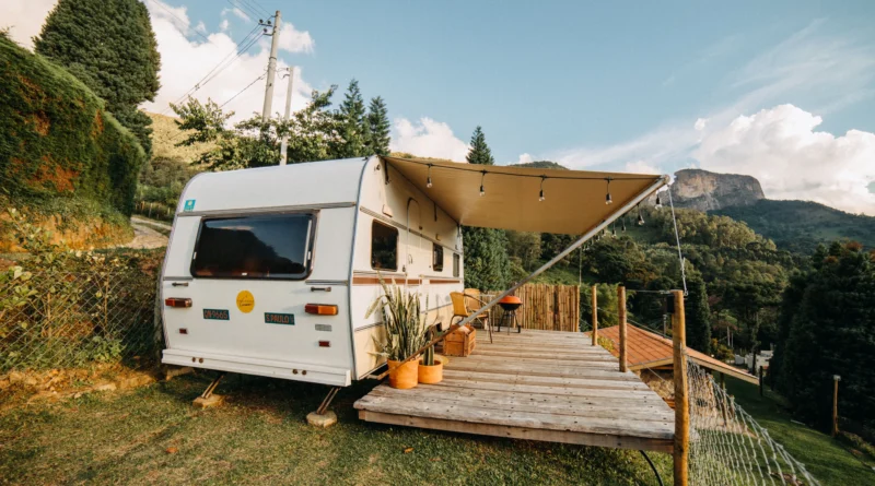 camping budget Canada - truck and trailer fueling up before a camping trip