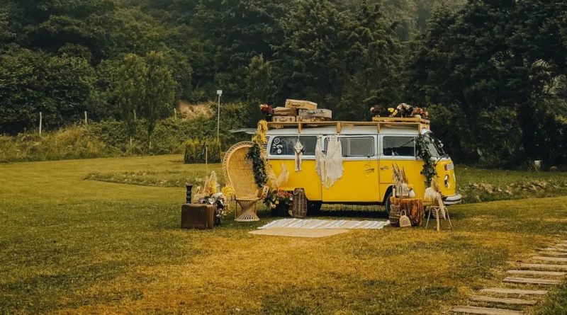 car camping vs backcountry camping - tent set up beside a forest trail