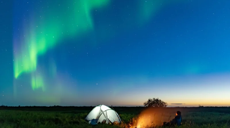 camping in Yukon and the Northern Territories - tent under the aurora borealis