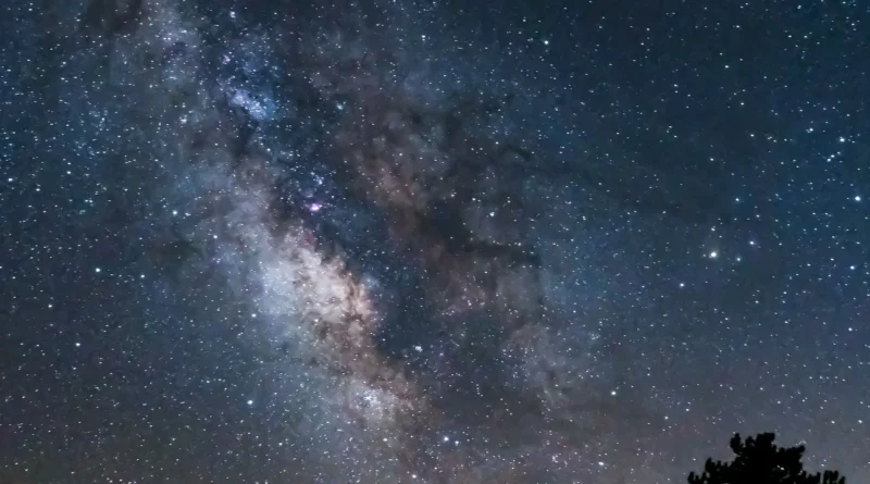 unique camping experiences Canada - stars over a mountain campsite at night