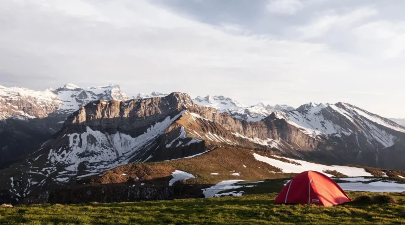 winter camping in the Canadian Rockies - snow-covered tent at dusk